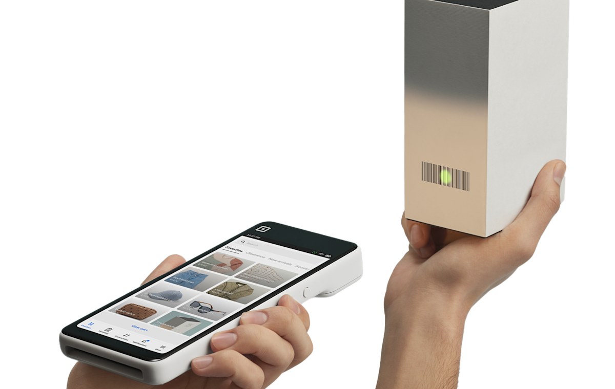 Square Handheld scanning a product barcode in one hand